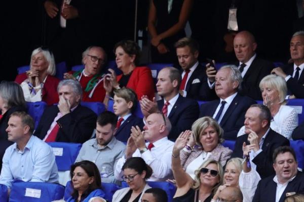 Patron of the Welsh Rugby Unio<em></em>n Britain's Prince William, Prince of Wales (C) looks on with his son Prince George of Wales (L) during the France 2023 Rugby World Cup quarter-final match between Wales and Argentina at the Stade Velodrome in Marseille, south-eastern France, on October 14, 2023. (Photo by Pascal GUYOT / AFP) (Photo by PASCAL GUYOT/AFP via Getty Images)