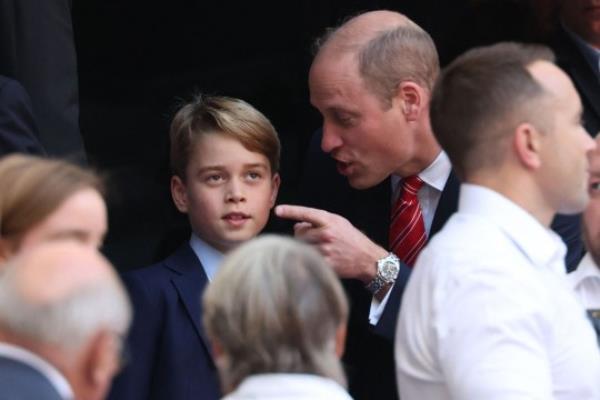 Patron of the Welsh Rugby Unio<em></em>n Britain's Prince William, Prince of Wales (CR) talks with his son Prince George of Wales (CL) during the France 2023 Rugby World Cup quarter-final match between Wales and Argentina at the Stade Velodrome in Marseille, south-eastern France, on October 14, 2023. (Photo by Pascal GUYOT / AFP) (Photo by PASCAL GUYOT/AFP via Getty Images)