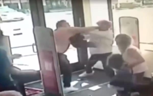 The quick-thinking dad jumped on the stranger, forcing the child out of his abductor's grasp and falling to the ground.