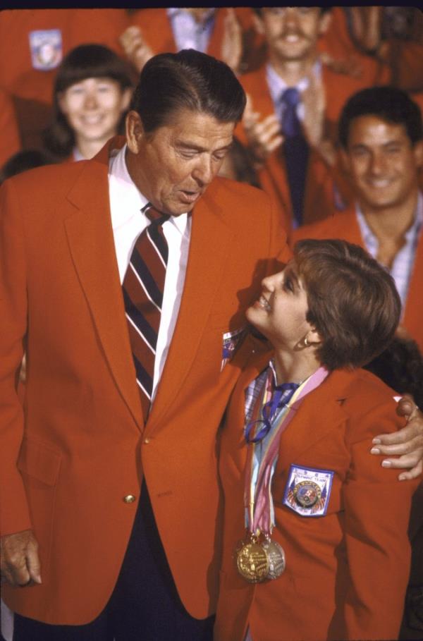 Ro<em></em>nald Reagan with his arm around Mary Lou Retton.