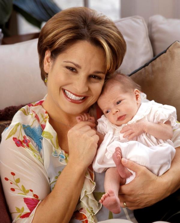 Mary Lou Retton holds her youngest daughter as a baby