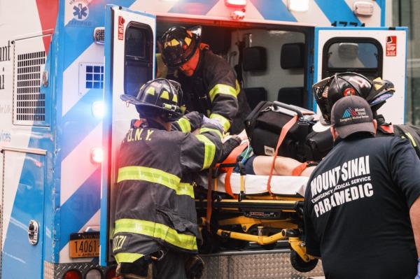 Paramedics working on subway push victim Eileen Donahue