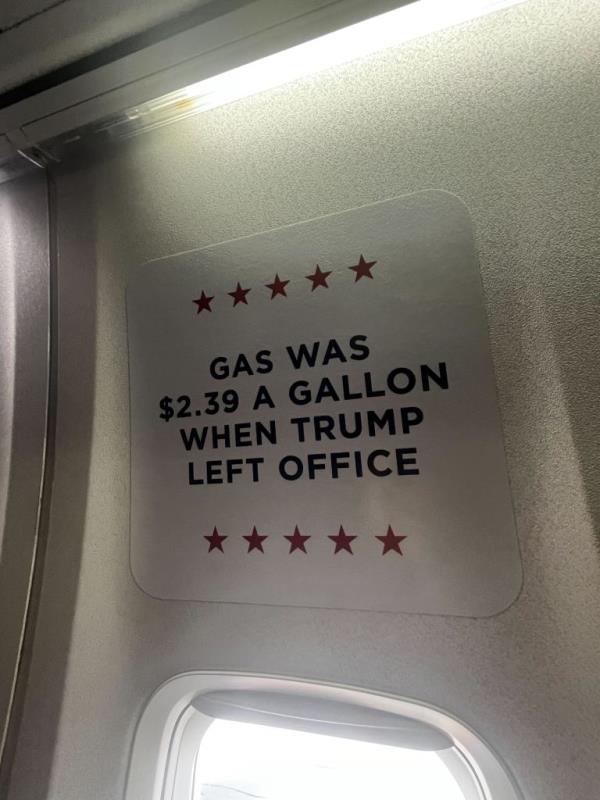 The plane feature's signs touting the Trump administration's accomplishments.