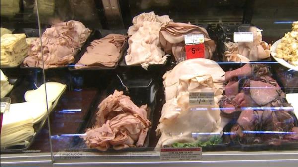 Trays of ready-to-eat meat in a store, potentially part of a large recall due to listeria concerns