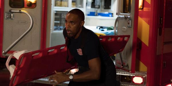 Ben Warren (Jason George) runs out of an ambulance on Station 19