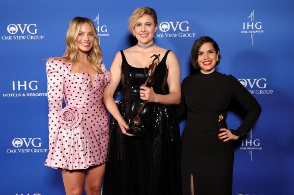 Greta Gerwig poses with the Director of the Year Award for 