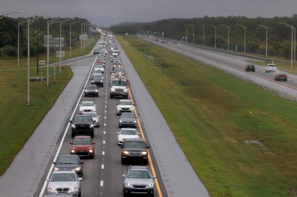 Cars fill the road as they drive out of Florida before the arrival of Hurricane Milton.