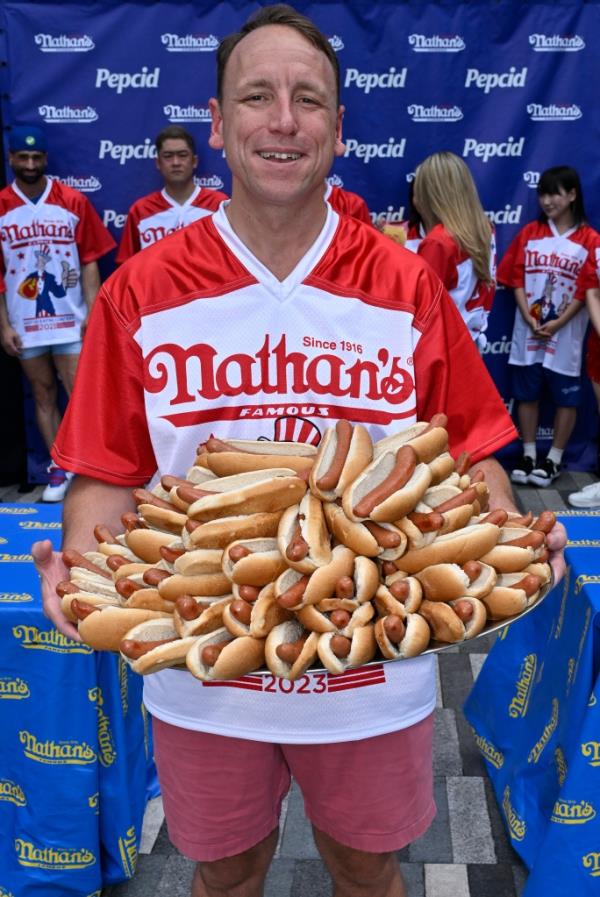 Joey Chestnut, the number one competitive eater in the world, hopes to best his record of 76 franks.  