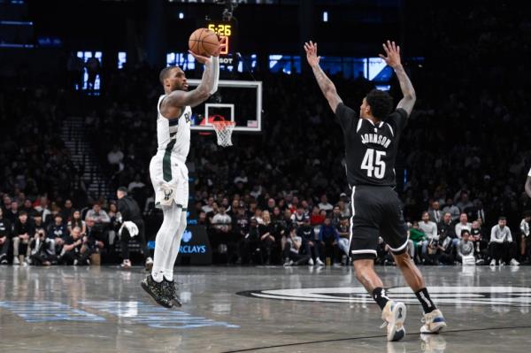 Damian Lillard attempts a 3-pointer during the Bucks' win against the Nets on Dec. 8.