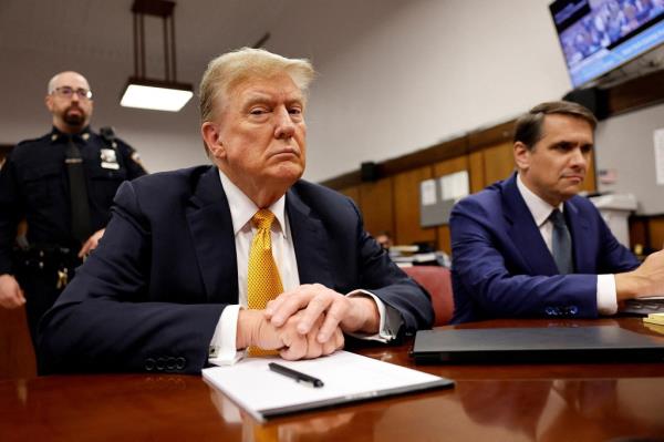 Former U.S. President Do<em></em>nald Trump sits in the courtroom at Manhattan Criminal Court with attorney Todd Blanche on May 21, 2024 in New York City.