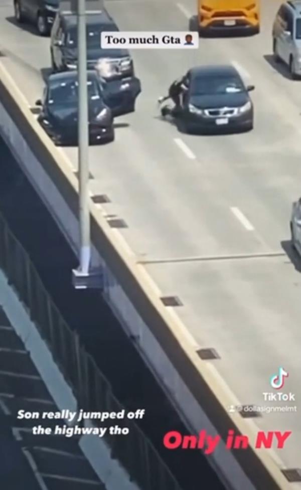 The man then tries to get into the car while the driver does their best to fend him off.