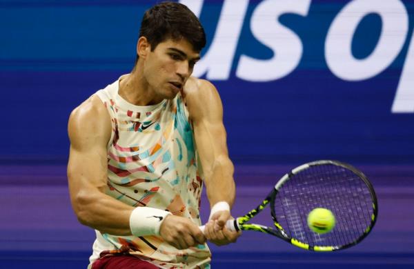 Carlos Alcaraz hits a backhand during his first-round win at the U.S. Open.