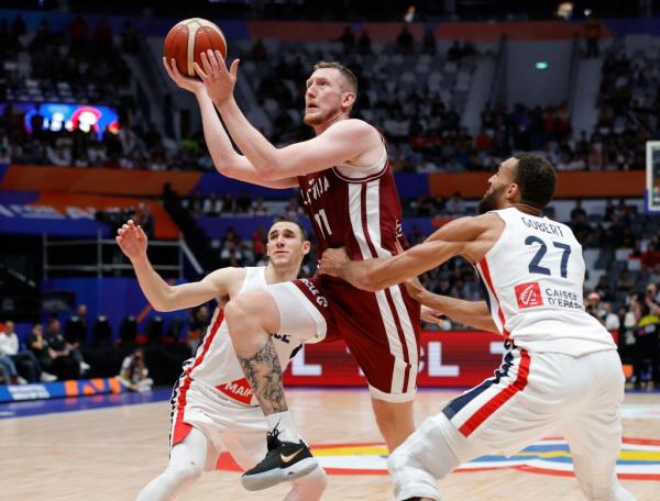 Latvia's Rolands Smits had 20 points on 8-of-10 shooting against France.