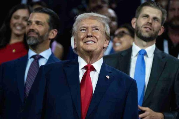 Do<em></em>nald Trump, the Republican presidential nominee, is pictured with his sons Don Jr., left, and Eric, in Fiserv Forum on the first day of Republican Natio<em></em>nal Co<em></em>nvention in Milwaukee, Wis.