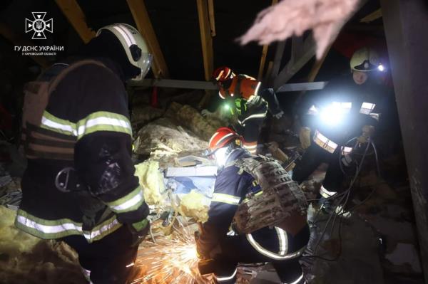 First respo<em></em>nders sift through the rubble following the missile strike.
