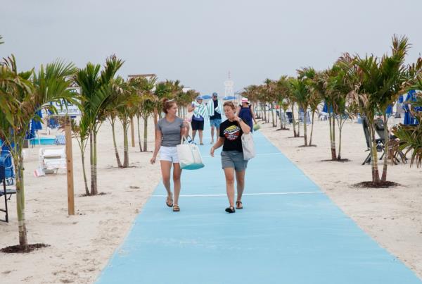 Members of The Sand Beach Club are seen enjoying a beach day. 