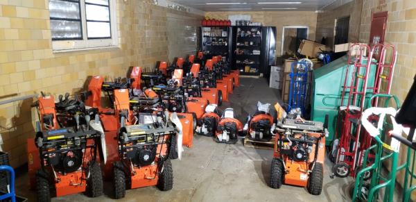 Rows of unused snowblowers.