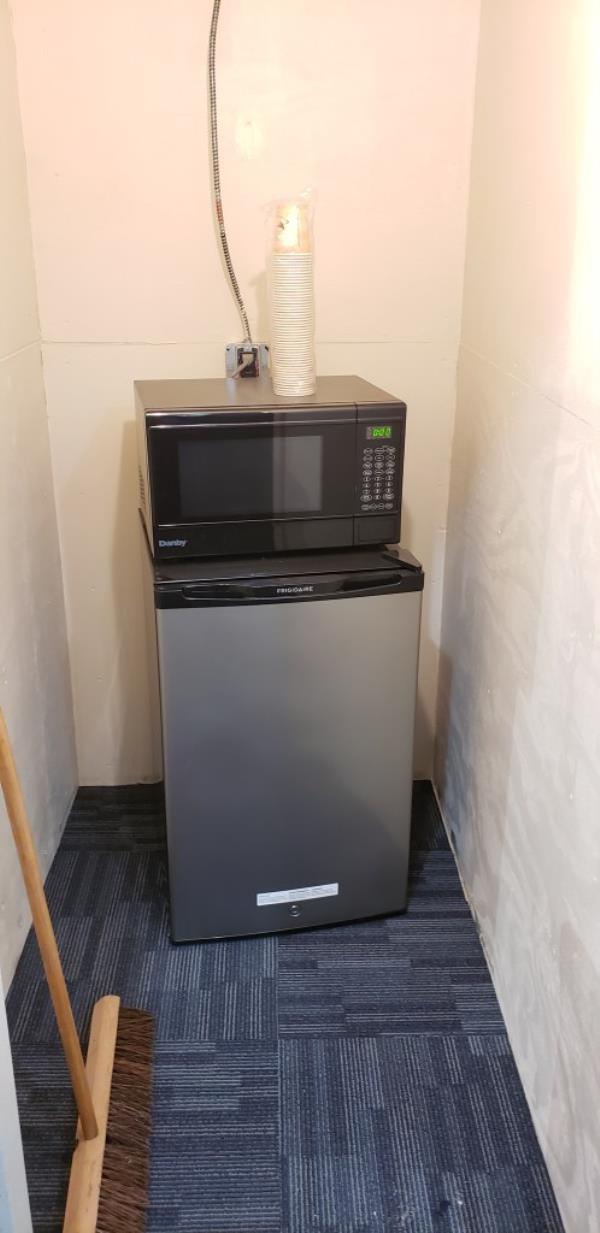 The mini fridge found in the lounge. 