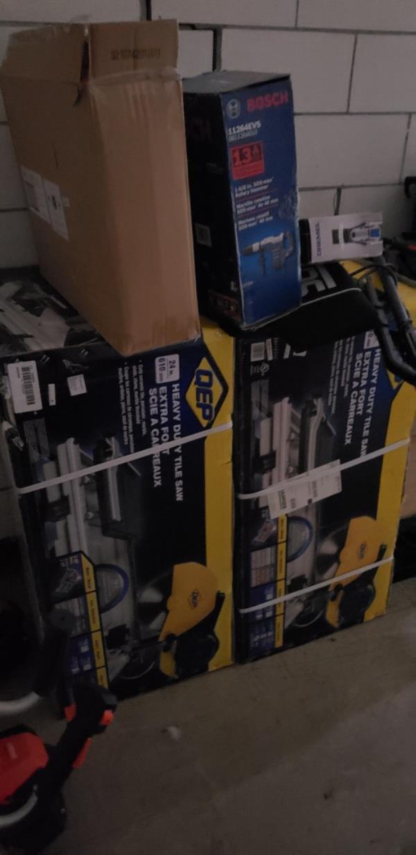 Other unopened boxes of tile saws.