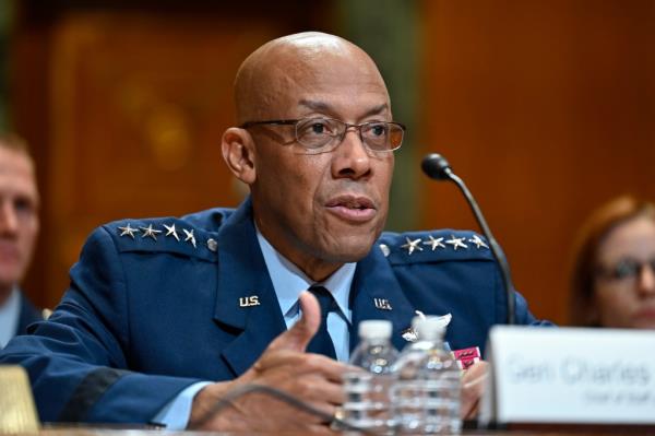 Gen. Charles Q. Brown speaks at a microphone