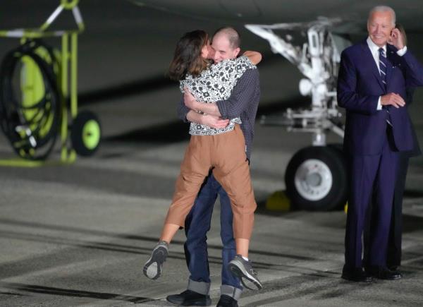 Reporter Evan Gershkovich hugs his mother, Ella Milman, following his release as part of a 24-person priso<em></em>ner swap between Russia and the United States on Aug. 1, 2024. 