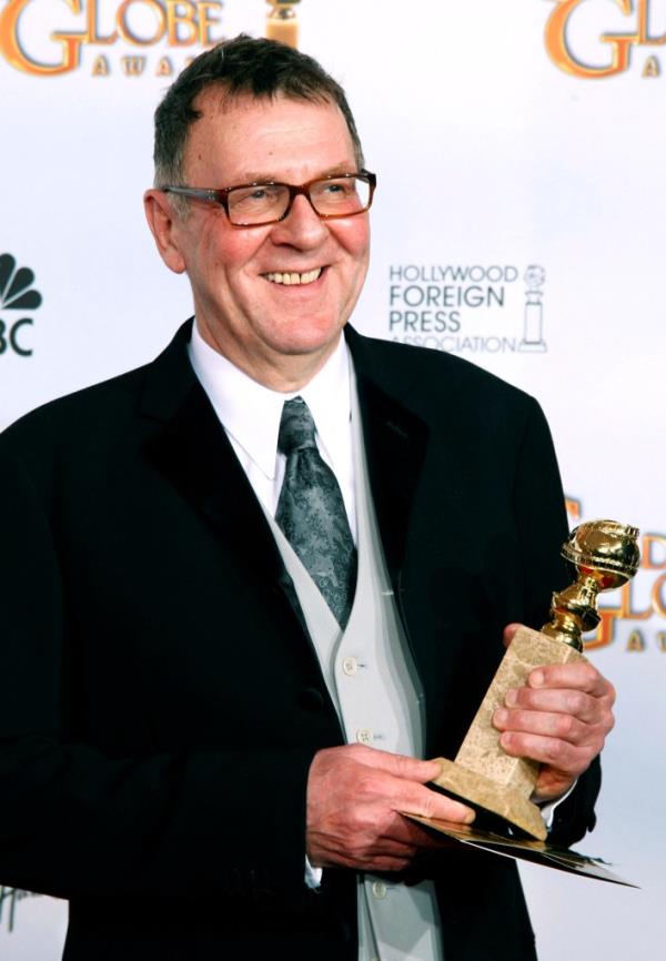 Wilkinson is seen with the Golden Globe he won for his role in the HBO miniseries 