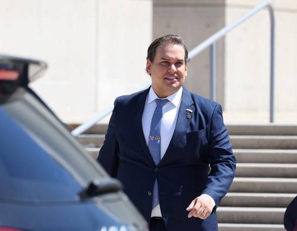 George Santos leaves Federal court in Central Islip, NY for a hearing.