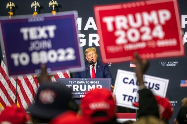 Republican presidential candidate and former President Do<em></em>nald Trump speaks to the crowd during a caucus event, Saturday, Dec. 2, 2023, at Kirkwood Community College in Cedar Rapids, Iowa.