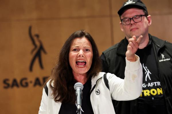 SAG-AFTRA unio<em></em>n President Fran Drescher speaks next to Duncan Crabtree-Ireland, SAG-AFTRA Natio<em></em>nal Executive Director and Chief Negotiator, at SAG-AFTRA offices after negotiations ended with the Alliance of Motion Picture and Television Producers (AMPTP), the entity that represents major studios and streamers, including Amazon, Apple, Disney, NBCUniversal, Netflix, Paramount, Sony, and Warner Bros Discovery, in Los Angeles, California, U.S., July 13, 2023. 