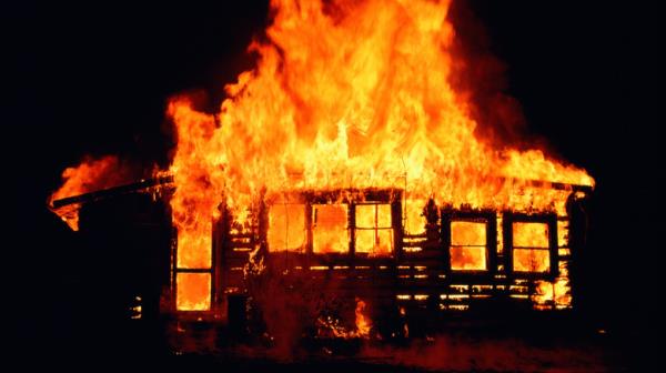 Wooden house on fire