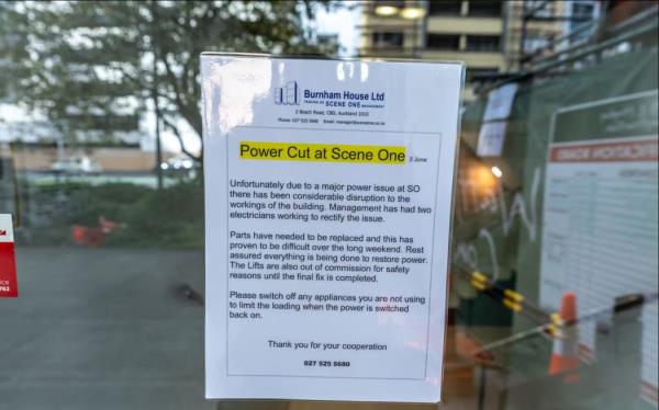 A notice on the door of Scene One warns of the disruption and advises residents two electricians were working to fix the issue. Photo / Michael Craig