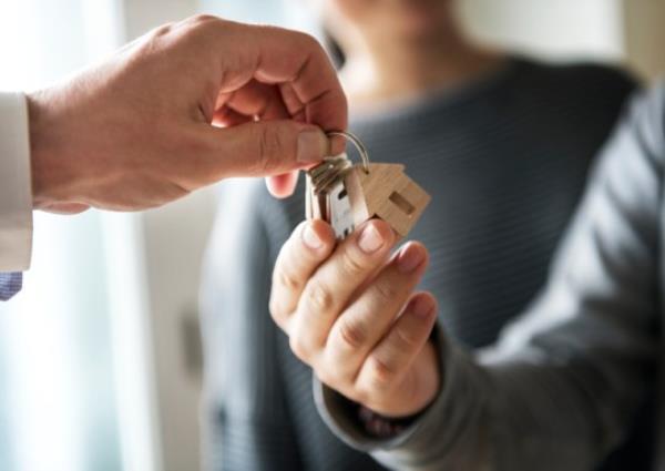 Family buy new house and receive house keys