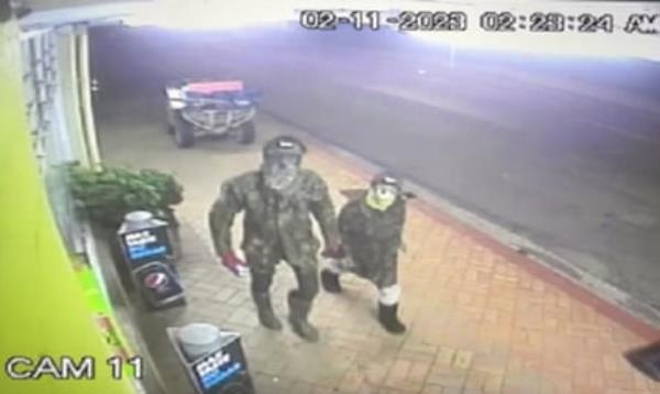 A man thought to be Tom Phillips and one of his children, caught on CCTV