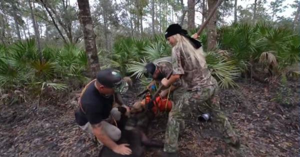 Natalie Reynolds attempts to kill the wild boar with a spear