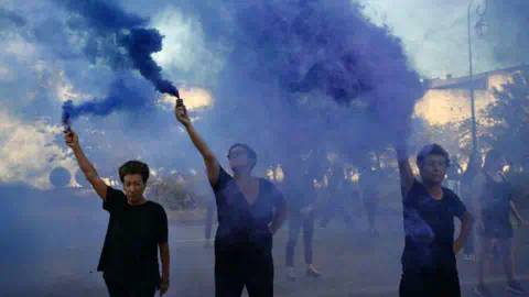 Christophe SIMON / AFP Demo<em></em>nstrators hold smoke bombs during a protest outside the courthouse during the trial of a man accused of drugging his wife Gisèle Pelicot for nearly 10 years and inviting strangers to rape her at their home in Mazan, a small town in the south of France, in Avignon, on September 2, 2024