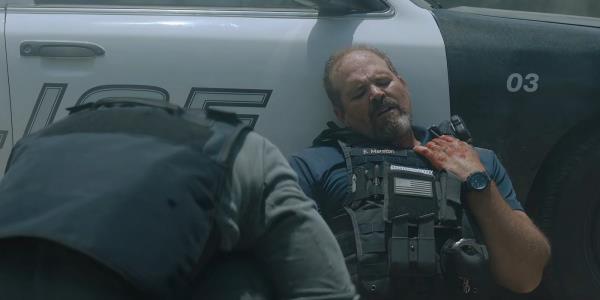 David Denman's Officer Evan Marston guiding Aaron Pierre's Terry Richmond in Rebel Ridge