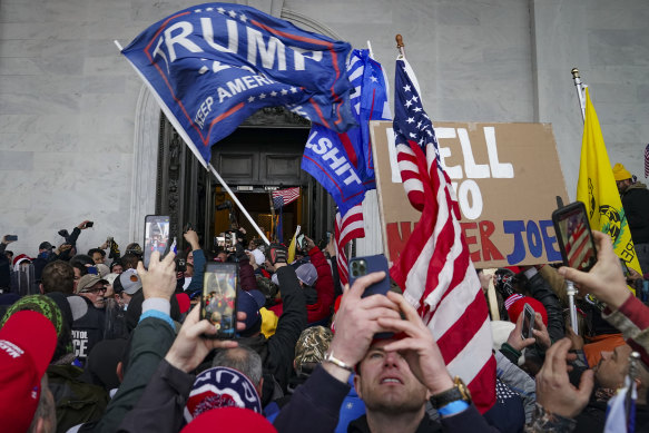 The violent crowd supporting  Do<em></em>nald Trump riot outside the Capitol in Washington.