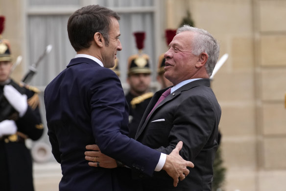 French President Emmanuel Macron, left, welcomes Jordan’s King Abdullah II to the Elysee Palace in Paris on Friday to talk a<em></em>bout a ceasefire in Gaza.