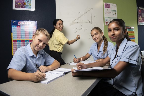 Glenwood High School year 8 maths class students Nathan Hobby, Halle Co<em></em>nyard and Yubi Gara being taught by Carmen Cheung.