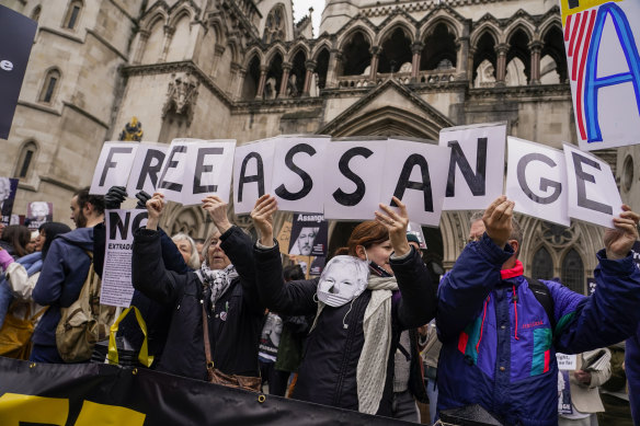Demo<em></em>nstrators hold banners outside the Royal Courts of Justice in London. WikiLeaks founder Julian Assange will make his final appeal against his impending extradition to the United States at the court.